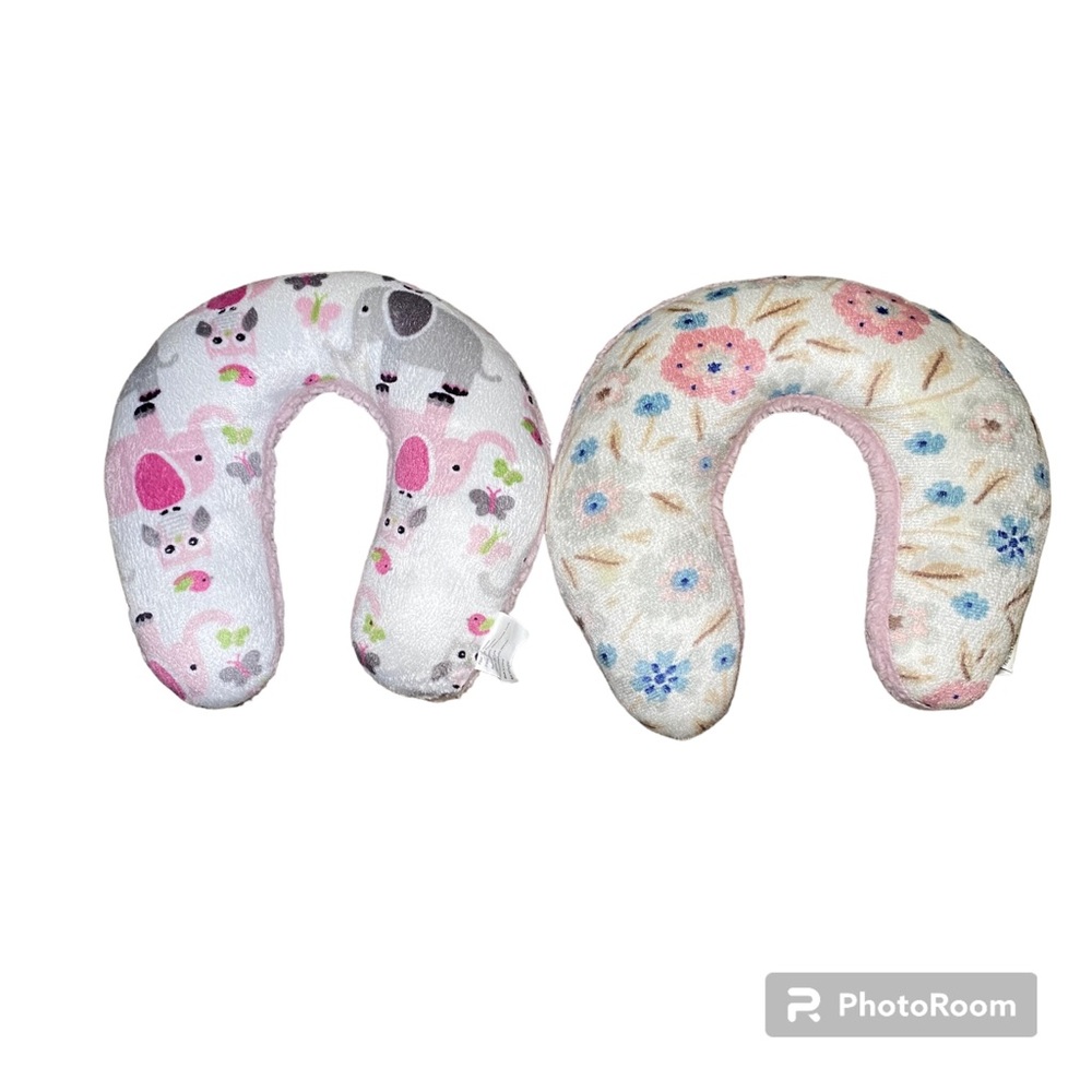 Baby girl headrest/pillow. Slightly used. Two pack .